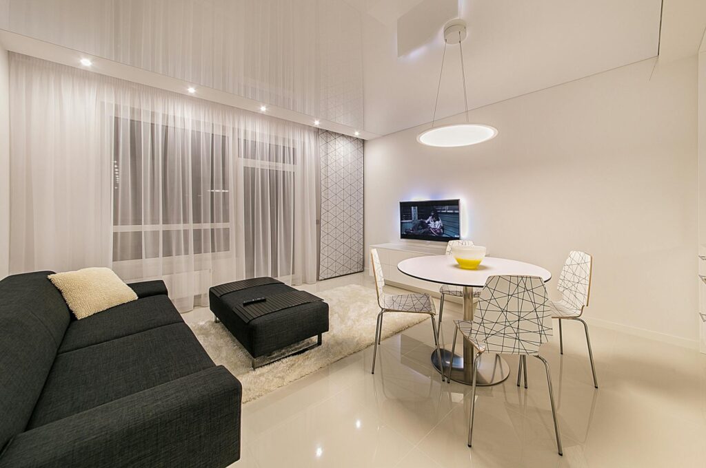 Sleek and stylish living room featuring modern furnishings and elegant lighting.